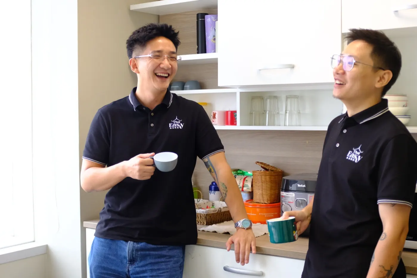 Two colleagues talking over coffee
