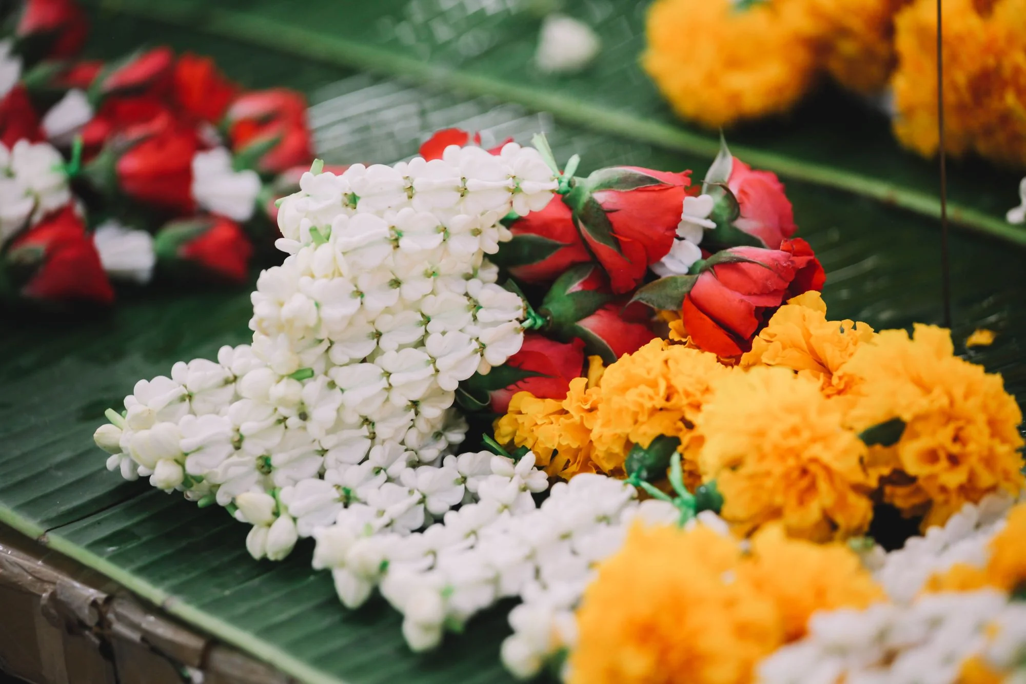 Traditional flower garlands at a Bangkok market